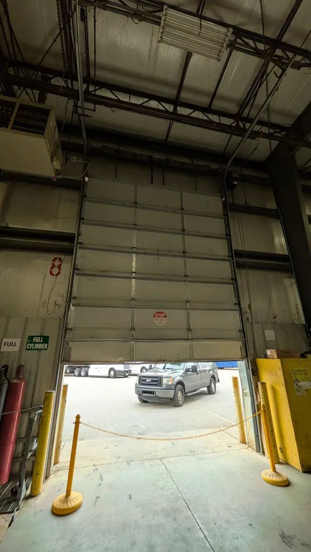 Commercial sectional door at a warehouse loading bay