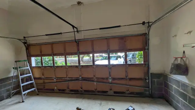 Garage door with a row of window panels, viewed from inside